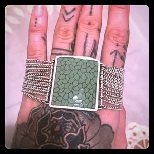 Silver and teal colored bracelet